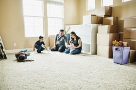 Moving-Boxes-Family-New-Home-Inside-1181707907.jpg