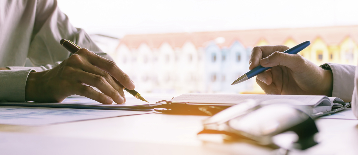 Hands-Signing-Documents-Business-Closing-Deal-GettyImages-869988876.jpg