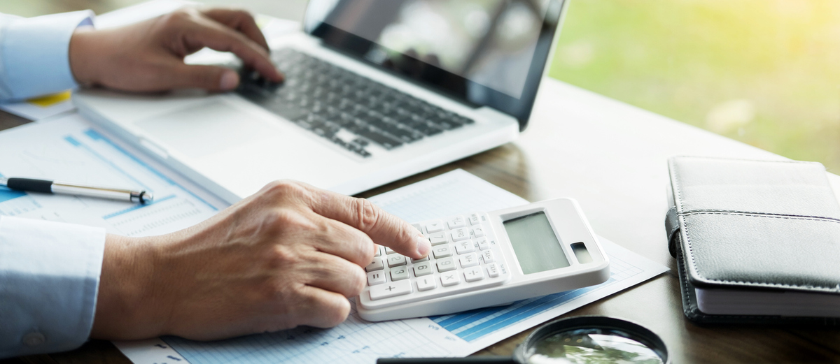 Hands-Laptop-Computer-Calculator-Work-Office-GettyImages-938886584.jpg